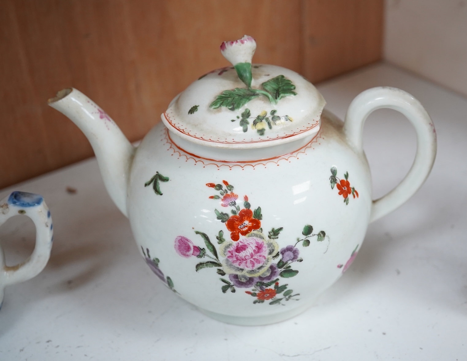 A Worcester teapot, c.1770, an 18th century Chinese famille rose and a blue and white dish, a small blue and white dish, a cup and saucer and teapot, largest dish 39cm (7). Condition - most damaged, cracked or chipped